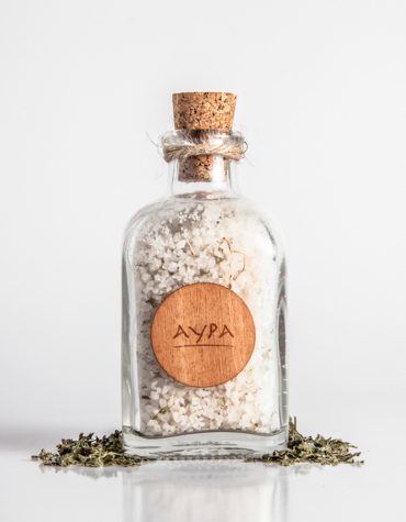 Glass bottle of bath salts full of minerals. Ideal for a relaxing bath. Unique experience of wellness.